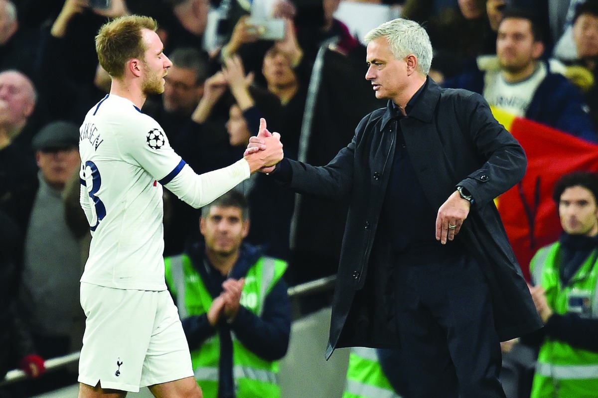 Tottenham Hotspur's Portuguese head coach Jose Mourinho (R) congratulates Tottenham Hotspur's Danish midfielder Christian Eriksen after the UEFA Champions League Group B football match between Tottenham Hotspur and Olympiakos at the Tottenham Hotspur Stad