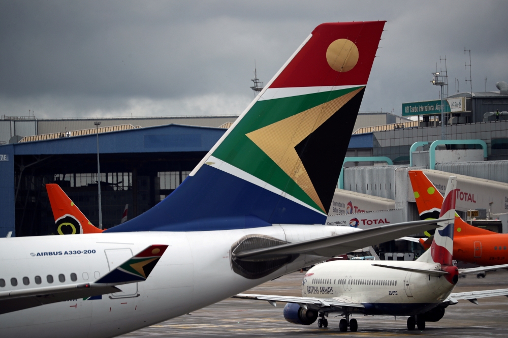 FILE PHOTO: The logo of South African Airways (SAA) is seen on an aircraft at O.R. Tambo International Airport in Johannesburg, South Africa, February 14, 2019. REUTERS/Mike Hutchings 
