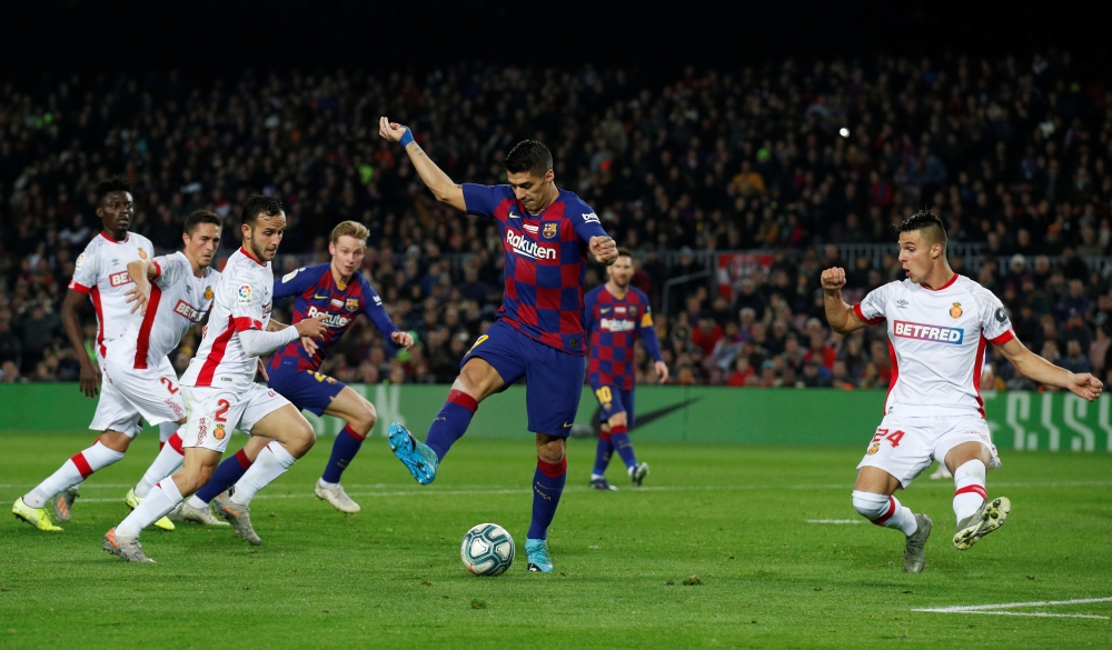 Barcelona's Luis Suarez scores their fourth goal REUTERS/Albert Gea