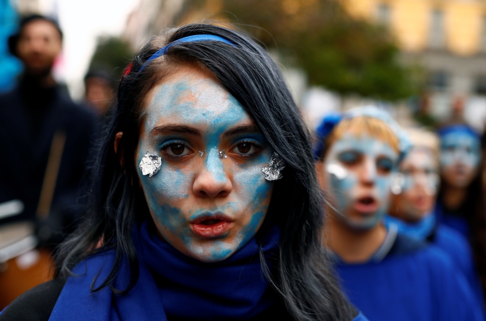 People attend an Extinction Rebellion protest against climate change as the COP25 climate summit is held in Madrid, Spain December 8, 2019. Reuters/Javier Barbancho
