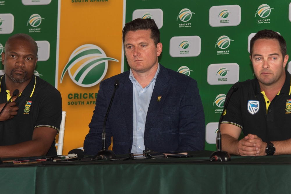Enoch Nkwe(L), Graeme Smith(C), and Mark Boucher(R), speak during a press conference at the Newlands Cricket grounds in Newlands, on December 14, 2019. / AFP / Brenton Geach 
