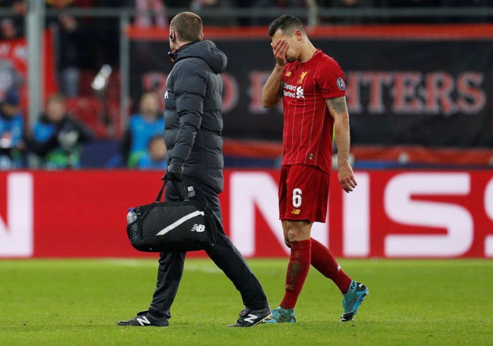Liverpool's Dejan Lovren looks dejected as he is substituted off after sustaining an injury. (Reuters/John Sibley)