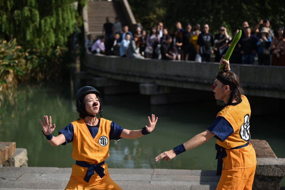 This photo taken on October 29, 2019, shows artists performing during the 7th annual Wuzhen Theatre Festival in Wuzhen in Zhejiang province, two hours from Shanghai. AFP / Hector Retamal 