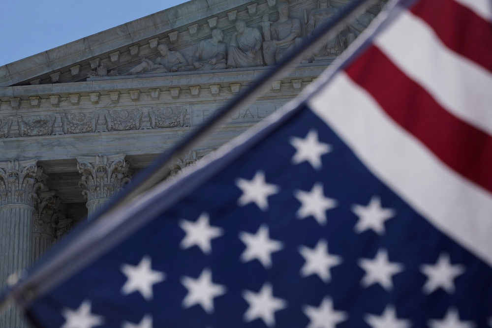 A flag is seen outside the US Supreme Court in Washington, June 25, 2018. Reuters / Toya Sarno Jordan  
  