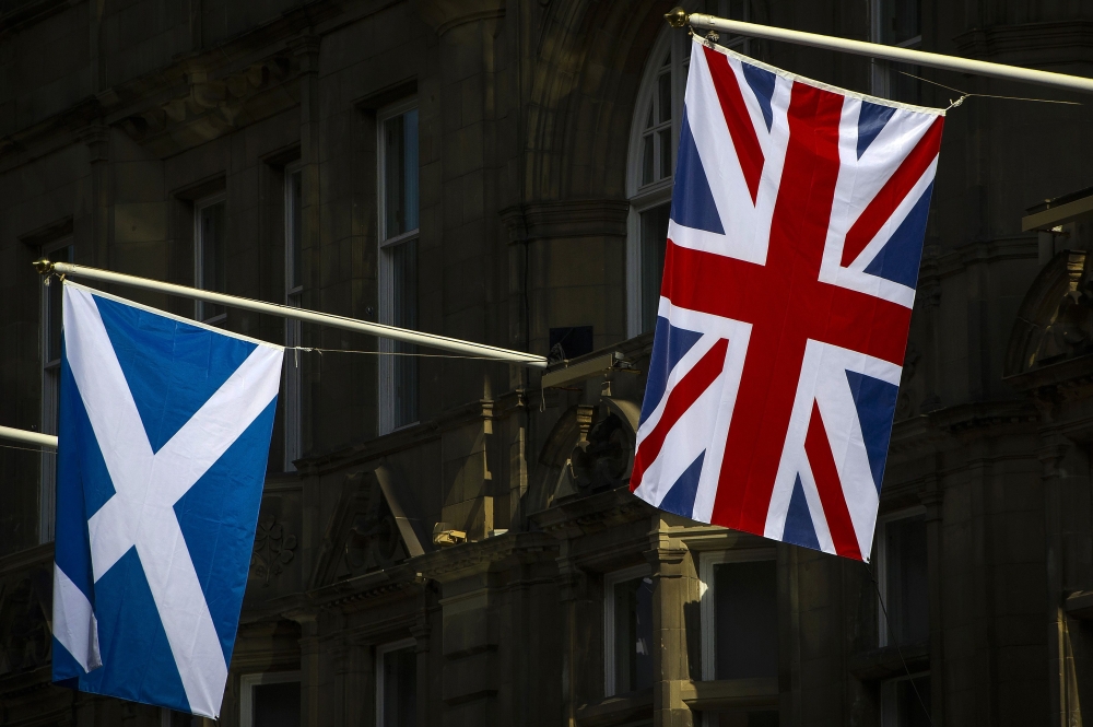 Flags of Scotland and the Union hang from flagpoles in Edinburgh, Scotland, on April 11, 2019. AFP / Andy Buchanan
