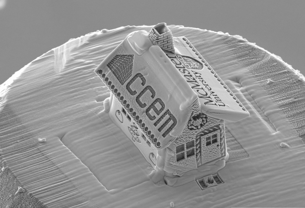 This image released on December 18, 2019, by the Canadian Centre for Electron Microscopy at McMaster University in Hamilton, Canada, show the tiniest gingerbread house on top of a snowman. AFP PHOTO / McMaster University / Travis Casagrande