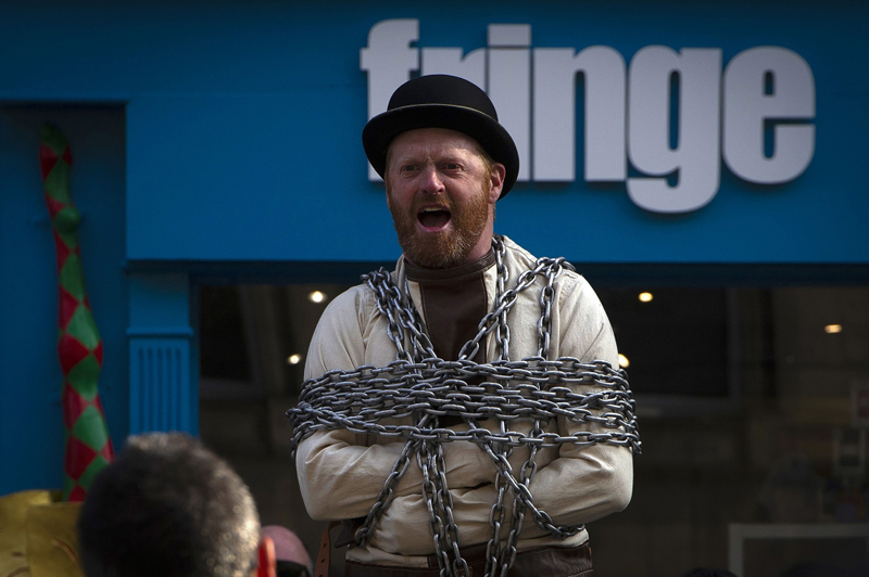 A street performer stages a show on The Royal Mile in Edinburgh, Scotland on April 11, 2019. AFP / Andy Buchanan