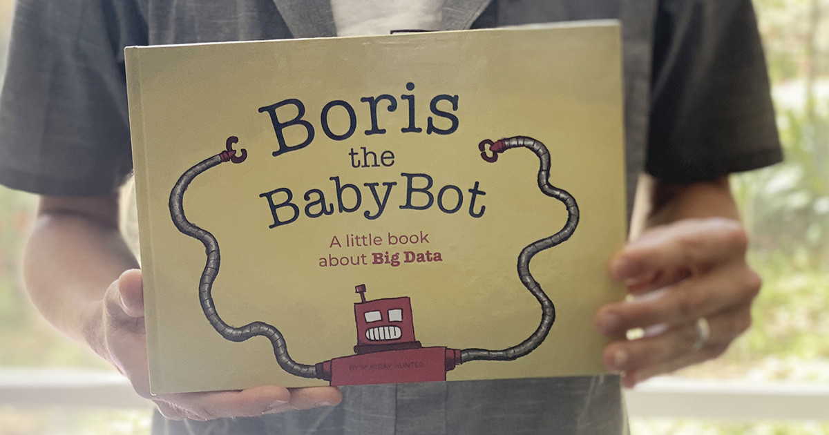 Author Murray Hunter holding his book 'Boris the Babybot' in Cape Town, South Africa, 30 October 2019. Murray Hunter/ Handout via Thomson Reuters Foundation