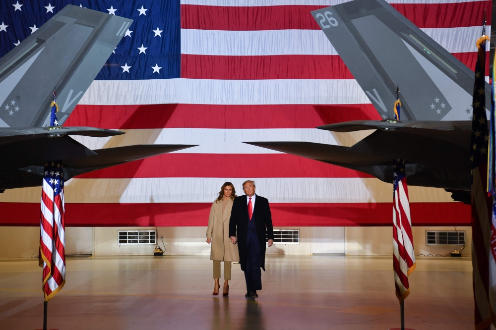 US President Donald Trump and First lady Melania Trump arrive for a signing ceremony on S.1790, the 