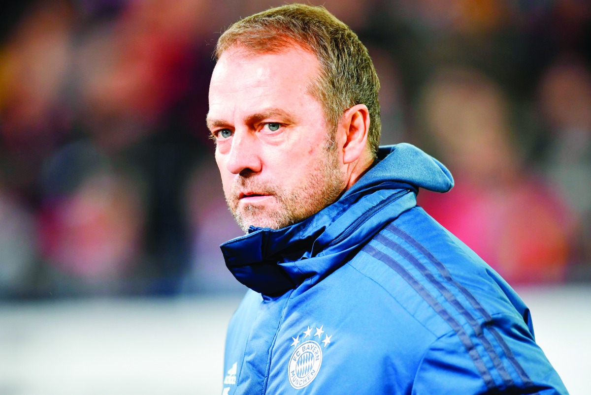 Munich's German head coach Hansi Flick waits for an interview before the German first division Bundesliga football match SC Freiburg v Bayern Munich, on December 18, 2019 in Freiburg. AFP / Thomas Kienzle