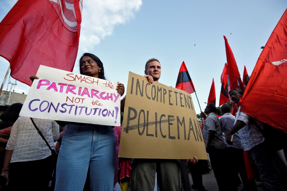 Jakob Lindenthal (C), a German student, attends a march to show solidarity with the students of New Delhi's Jamia Millia Islamia university after police entered the university campus following a protest against a new citizenship law, in Chennai, India, De