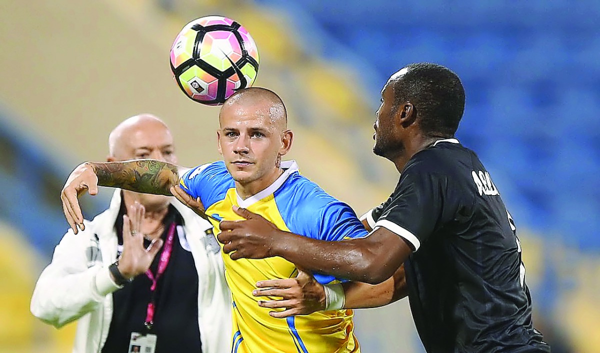 Vladimir Weiss (C) vies for the ball in this file photo