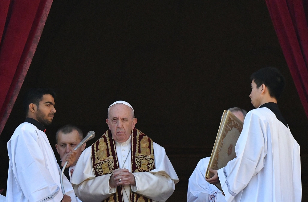 Pope Francis celebrates from the balcony of St Peter's basilica during the traditional 
