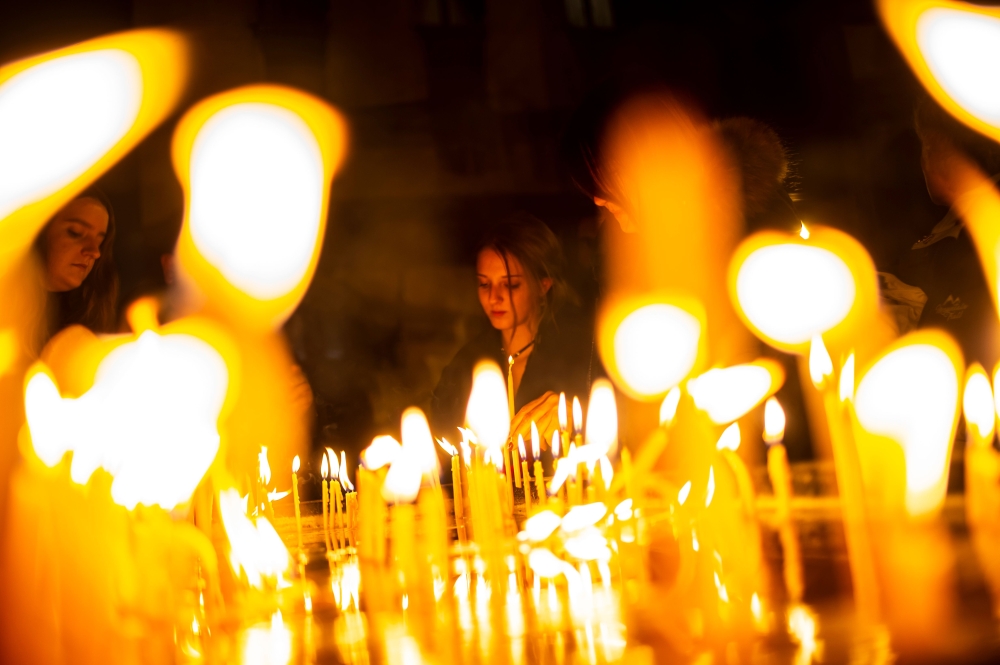 Representative image: Worshippers light candles as they attend Christmas Mass at the Saint Antuan Church in the Beyoglu district of Istanbul, on December 24, 2019.  AFP / Yasin Akgul
 