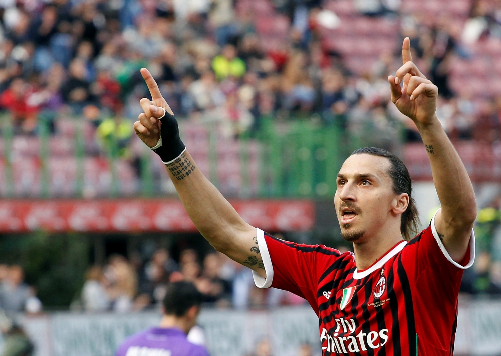 AC Milan's Zlatan Ibrahimovic celebrates after scoring a penalty against Fiorentina during their Italian Serie A soccer match at the San Siro stadium in Milan April 7, 2012. REUTERS/Alessandro Garofalo/File Photo