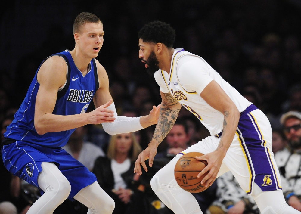 December 29, 2019; Los Angeles, California, USA; Los Angeles Lakers forward Anthony Davis (3) moves the ball against Dallas Mavericks forward Kristaps Porzingis (6) during the first half at Staples Center. Mandatory Credit: Gary A. Vasquez-USA TODAY Sport