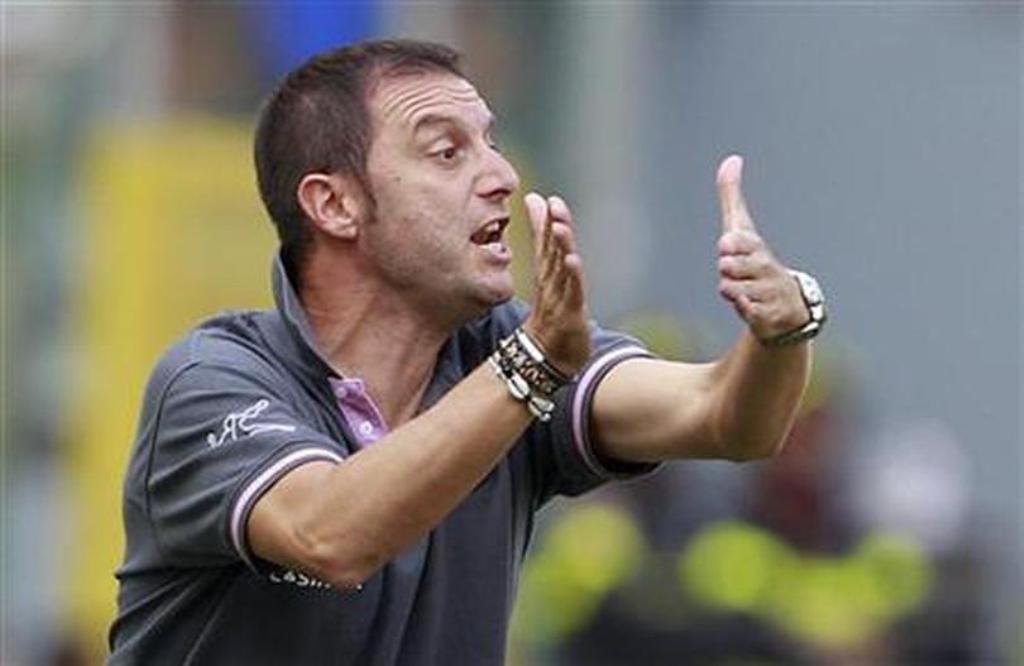 Devis Mangia reacts during a soccer match at the Olympic stadium. Rome. September 25, 2011. REUTERS/Tony Gentile