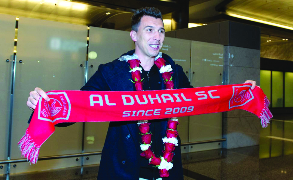 Croatian international Mario Mandzukic poses for a picture upon his arrival in Doha. 