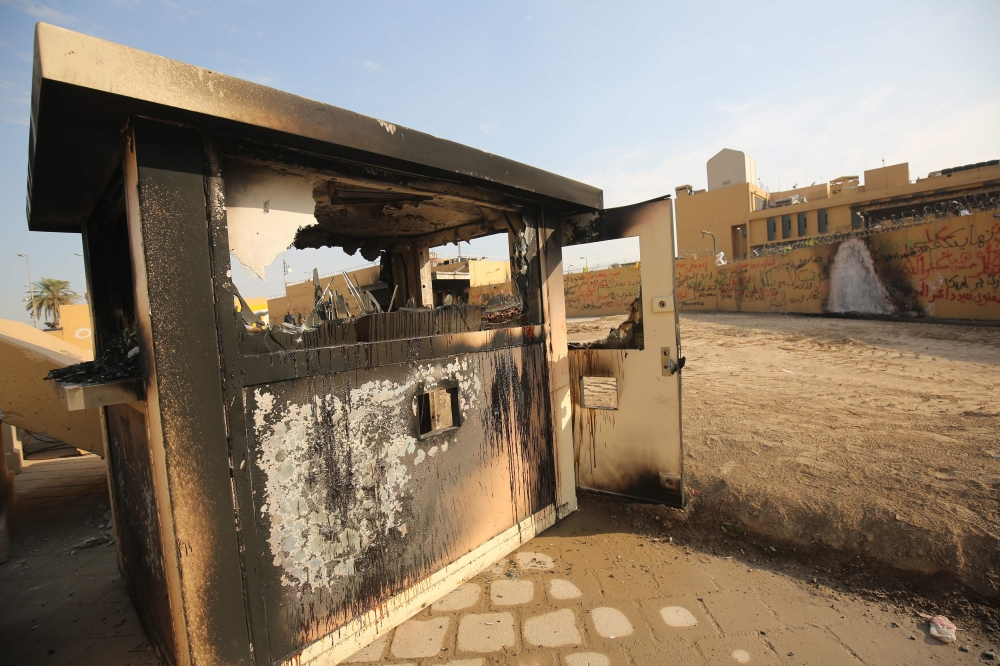 A picture shows the entrance leading to the US embassy in the capital Baghdad on January 2, 2020, which was damaged the day before by Hashed supporters. (AFP / AHMAD AL-RUBAYE)