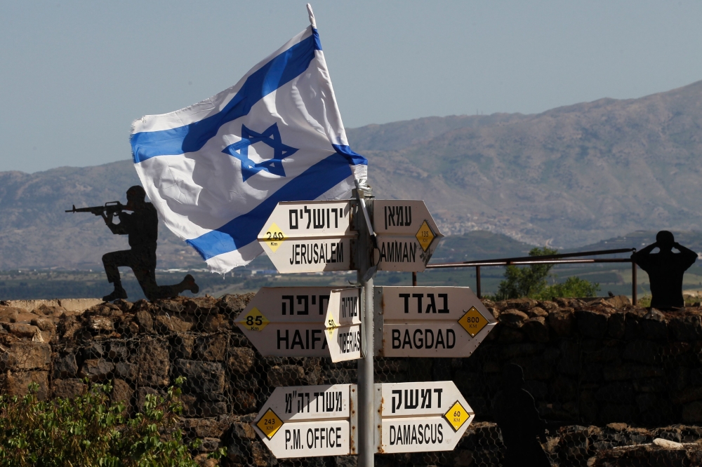 An Israeli flag is seen placed on Mount Bental in the Israeli-annexed Golan Heights on May 10, 2018. AFP / Jalaa Marey