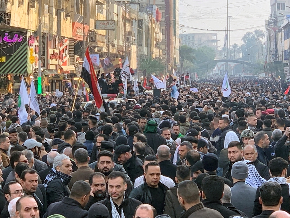 People gather at the funeral of the Iranian Major-General Qassem Soleimani, top commander of the elite Quds Force of the Revolutionary Guards, and the Iraqi militia commander Abu Mahdi al-Muhandis, who were killed in an air strike at Baghdad airport, in B