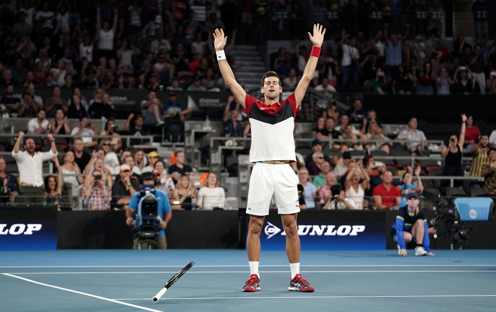 Novak Djokovic of Serbia reacts after winning his singles match against Kevin Anderson of South Africa on day 2 of the ATP Cup tennis tournament at Pat Rafter Arena in Brisbane, Australia, January 4, 2020. AAP Image/Dave Hunt