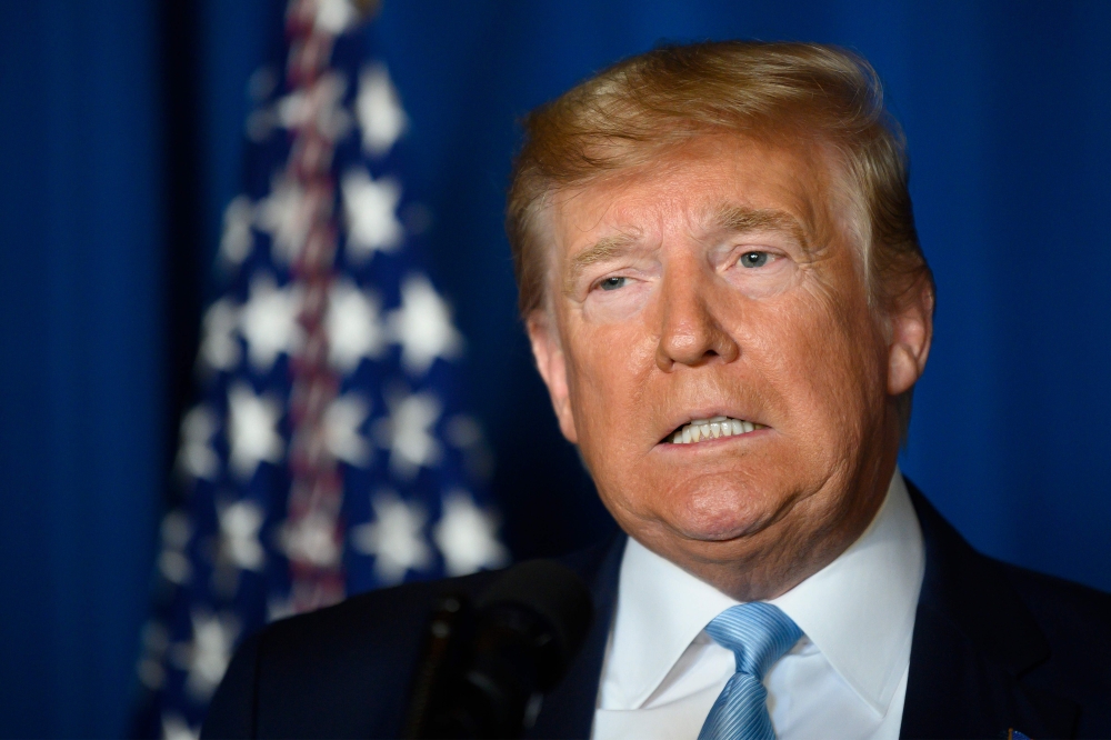 (FILES) In this file photo taken on January 3, 2020, US President Donald Trump makes a statement on Iran at the Mar-a-Lago estate in Palm Beach Florida. AFP / Jim Watson 
