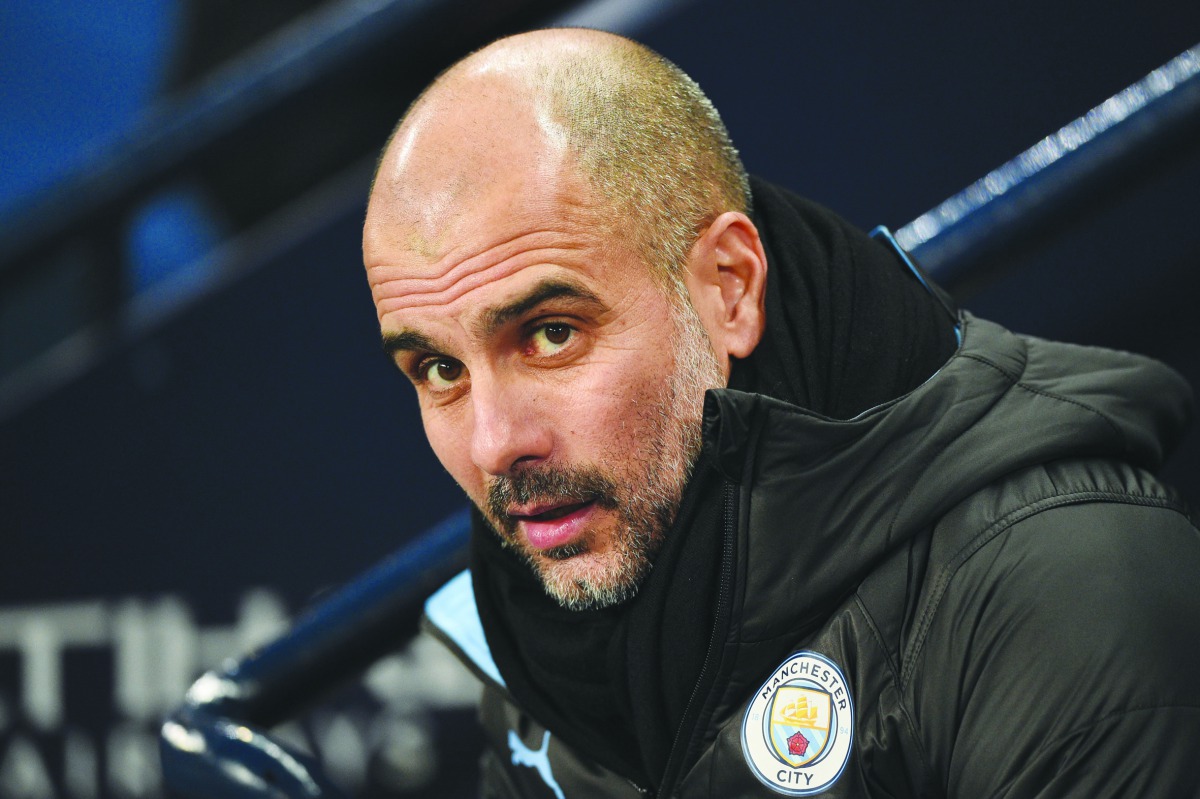 Manchester City's Spanish manager Pep Guardiola awaits kick off in the English Premier League football match between Manchester City and Everton at the Etihad Stadium in Manchester, north west England, on January 1, 2020.  AFP / Oli Scarff