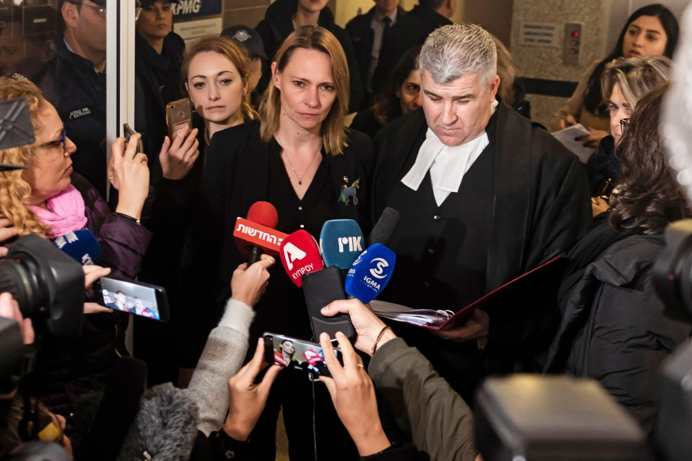 The mother and lawyer of a British teenager, convicted of falsely accusing a group of Israelis of gang-rape, address the media outside the Famagusta District Court in Paralimni in eastern Cyprus on January 7, 2020. AFP / Iakovos HATZISTAVROU