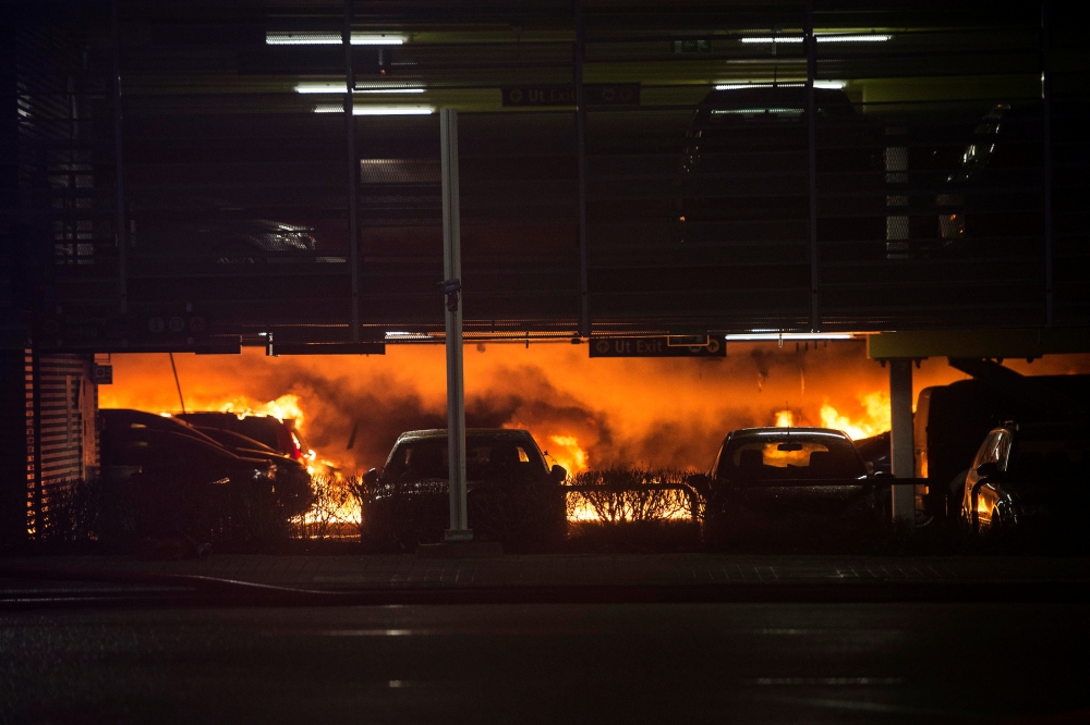  A fire is seen in a parking garage at Stavanger Airport, Norway January 7, 2020. Picture taken January 7, 2020. NTB Scanpix/Carina Johansen via REUTERS 
