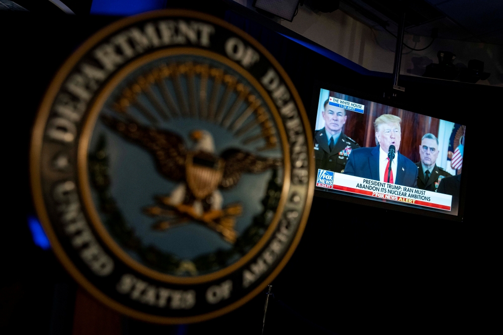US President Donald Trump is seen on a television screen as he delivers a statement about Iran, seen in the Pentagon briefing room in Arlington, Virginia, US, January 8, 2020. Reuters/Al Drago
 