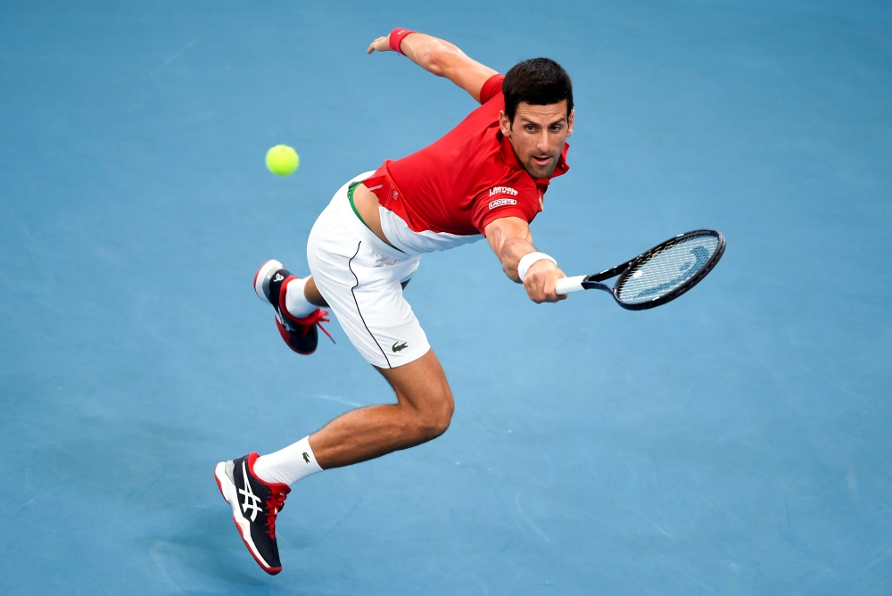  Novak Djokovic of Serbia hits a return in his men's singles match against Denis Shapovalov of Canada at the ATP Cup tennis tournament in Sydney on January 10, 2020. -- I
/ AFP / William WEST /