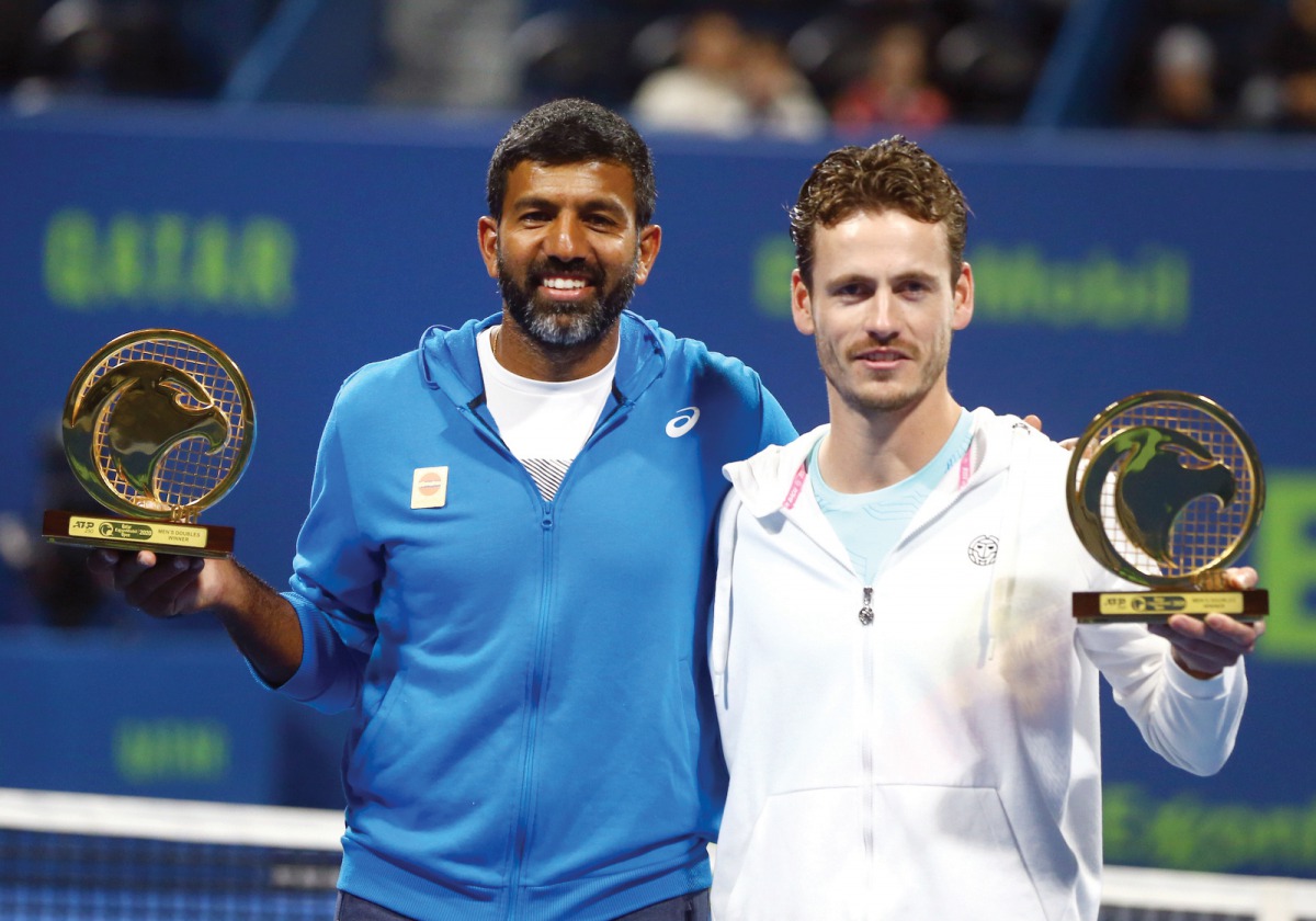 India's Rohan Bopanna (left) and Wesley Koolhof of the Netherlands celebrate during the presentation ceremony after winning the Doubles final of the Qatar ExxonMobil Open 2020 at the Khalifa International Tennis and Squash Complex in Doha, yesterday. (Pic