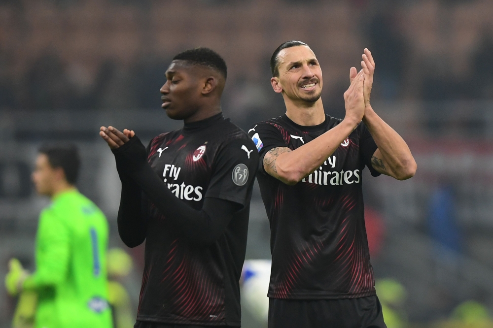 AC Milan's Portuguese forward Rafael Leao (L) and AC Milan's Swedish forward Zlatan Ibrahimovic acknowledge the public at the end of the Italian Serie A football match AC Milan vs Sampdoria on January 6, 2020 at the San Siro stadium in Milan. / AFP / Migu