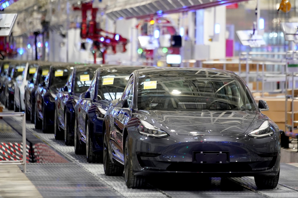  Tesla China-made Model 3 vehicles are seen during a delivery event at its factory in Shanghai, China January 7, 2020. REUTERS/Aly Song 