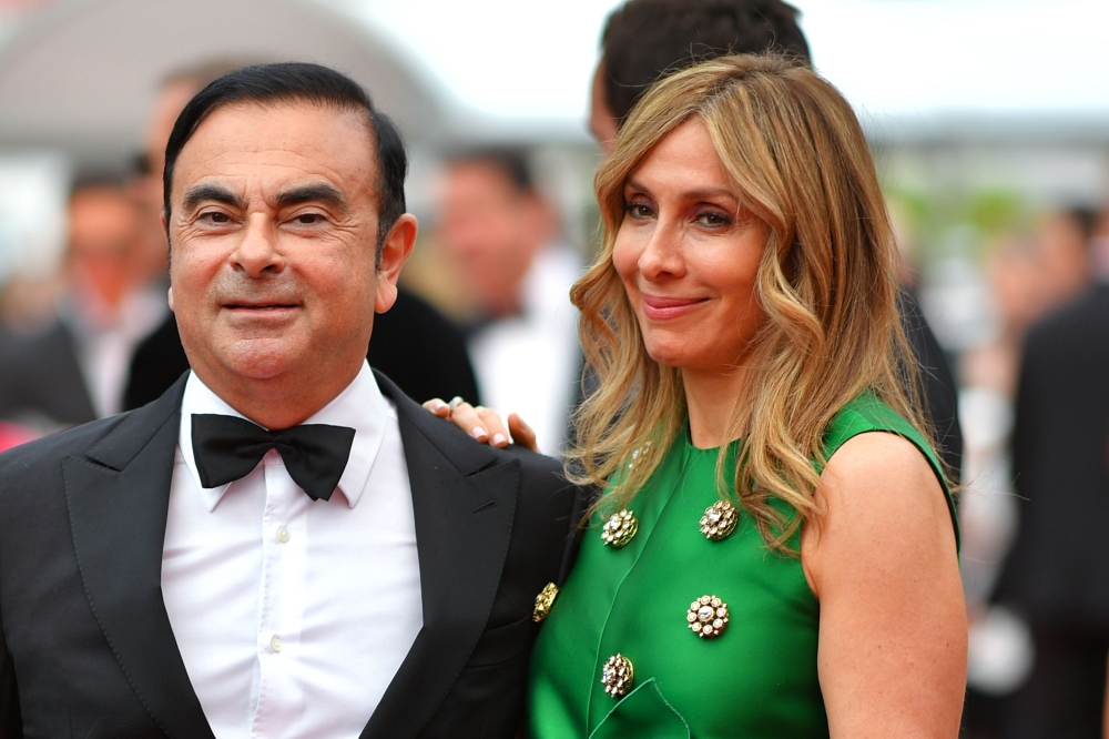 Carlos Ghosn and his wife Carole arriving for the screening of the film ‘Amant Double’ at the 70th edition of the Cannes Film Festival on May 26, 2017. AFP / Loic Venance