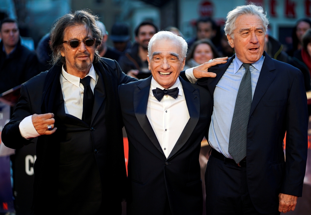 Director Martin Scorsese and cast members Al Pacino and Robert De Niro pose as they arrive for the screening of 