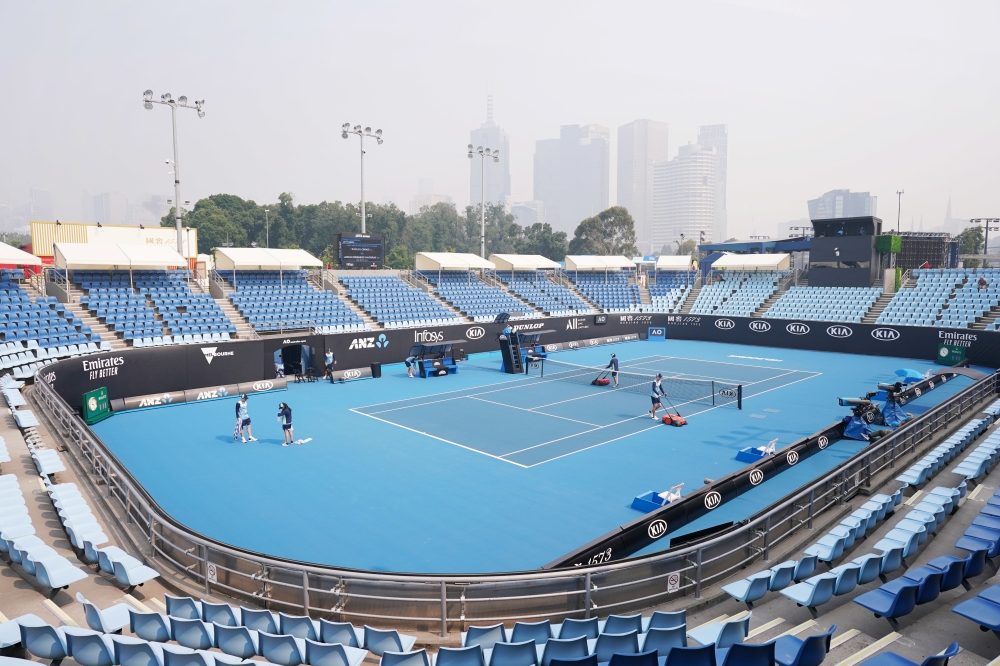 A general view is seen with the city skyline shrouded by smoke haze from bushfires during an Australian Open practice session at Melbourne Park in Melbourne, Australia, January 14, 2020. AAP Image/Michael Dodge/via REUTERS 