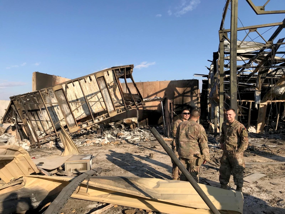 U.S. soldiers are seen at the site where an Iranian missile hit at Ain al-Asad air base in Anbar province, Iraq January 13, 2020. REUTERS/John Davison 