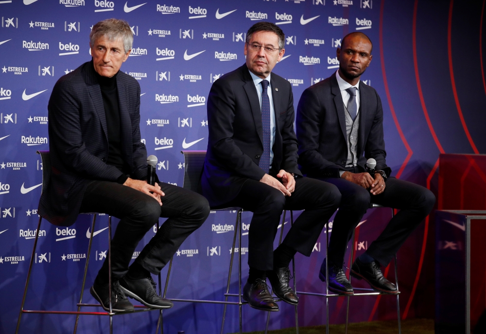 New FC Barcelona coach Quique Setien, president Josep Maria Bartomeu and sports director Eric Abidal during the press conference REUTERS/Albert Gea
