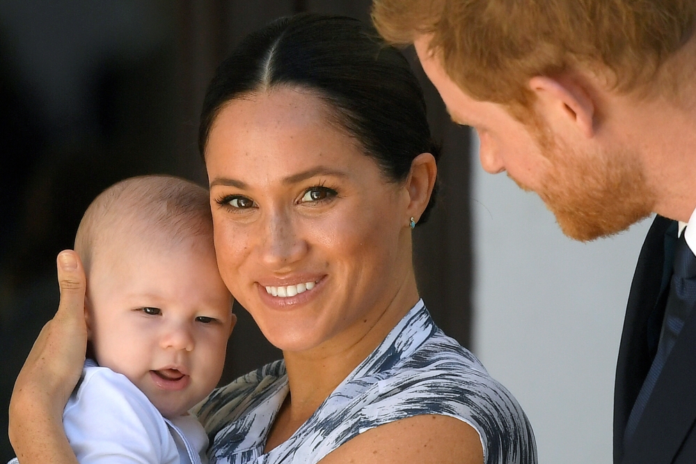 FILE PHOTO: Britain's Prince Harry and his wife Meghan, Duchess of Sussex, holding their son Archie, meet Archbishop Desmond Tutu (not pictured) at the Desmond & Leah Tutu Legacy Foundation in Cape Town, South Africa, September 25, 2019. REUTERS/Toby Melv