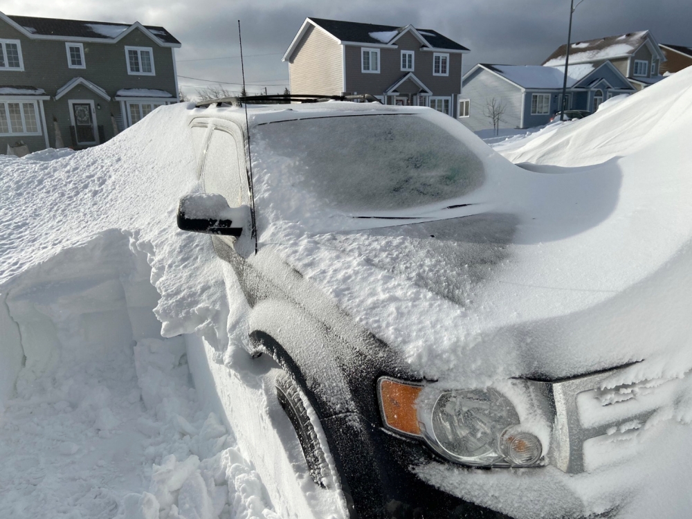 Pile of snow is pictured outside a house in St John's, Newfoundland And Labrador, Canada January 18, 2020 in this picture obtained from social media. J. David Mitchell/via Reuters