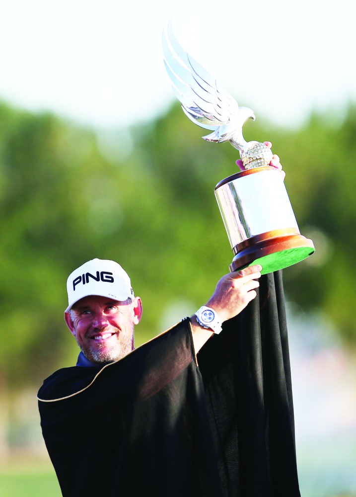 Lee Westwood of England poses with the trophy after winning the Abu Dhabi HSBC Golf Championship in the United Arab Emirates' capital on January 19, 2020. AFP