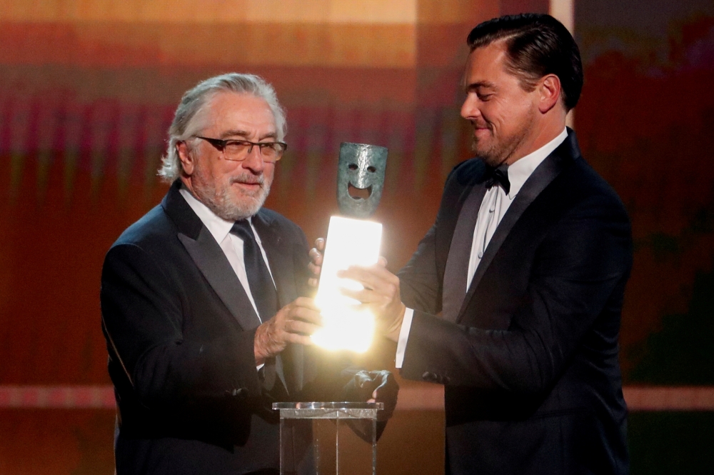  26th Screen Actors Guild Awards - Show - Los Angeles, California, U.S., January 19, 2020 - Robert De Niro accepts the Life Achievement Award from presenter Leonardo DiCaprio. REUTERS/Mario Anzuoni