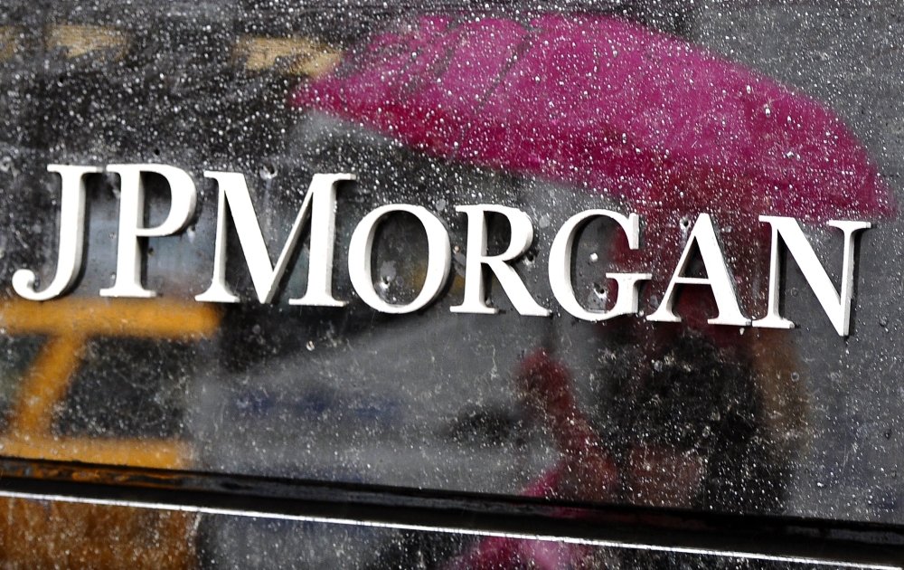 In this file photo taken on May 15, 2012 people walk past the JP Morgan Chase Building on Park Avenue in New York. AFP / Timothy A Clary
 