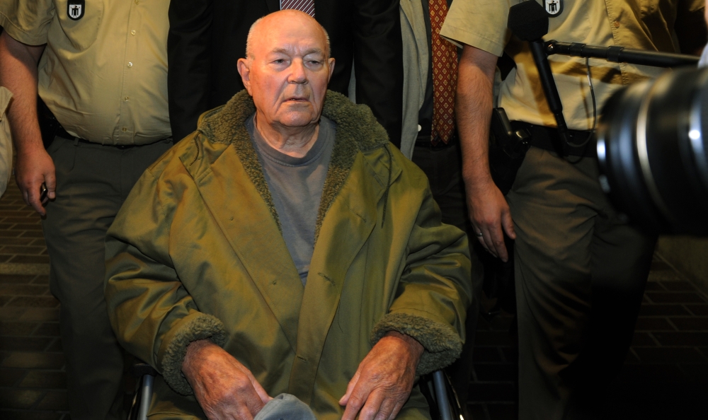 In this file photo taken on May 12, 2011 John Demjanjuk leaves the court after his verdict in Munich, southern Germany. AFP / Christof Stache 