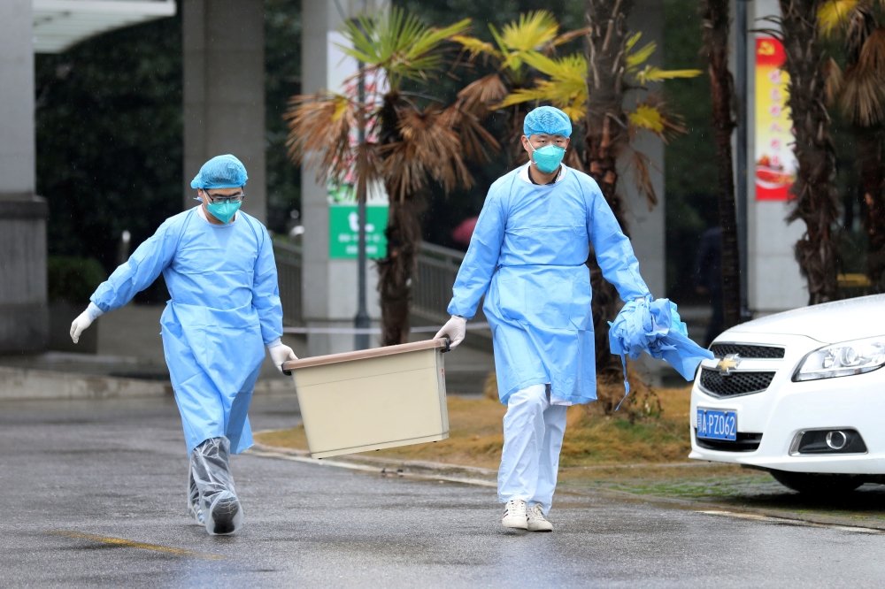 Medical staff carry a box as they walk at the Jinyintan hospital, where the patients with pneumonia caused by the new strain of coronavirus are being treated, in Wuhan, Hubei province, China January 10, 2020.  (REUTERS/Stringer/File Photo)