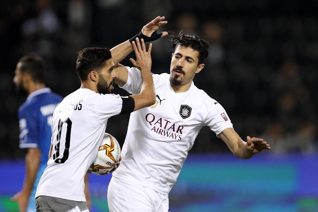 Al Sadd's Baghdad Bounedjah (right) and Hassan Al Haydos celebrate a goal against Al Shahania during their QNB Stars League game yesterday.  