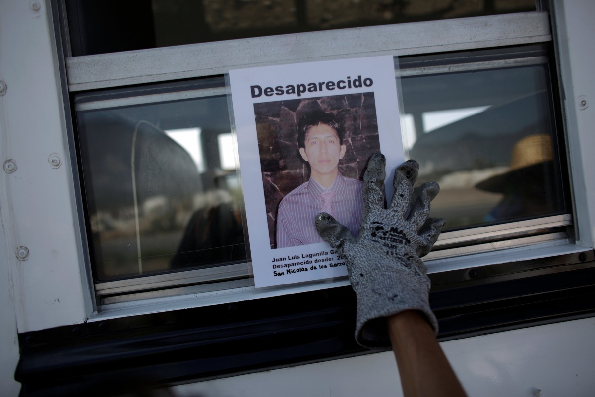 Representative image (A woman holds the photograph of a relative lost in fight between drug gangs during a serach at Escobedo on the outskirts of Monterrey, Mexico, August 12, 2016. Reuters / Daniel) 