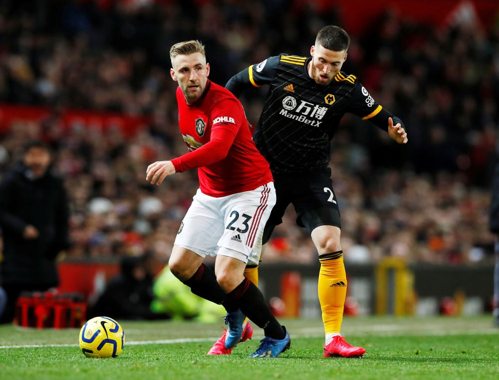 Manchester United's Luke Shaw in action with Wolverhampton Wanderers' Matt Doherty Action Images via Reuters/Jason Cairnduff